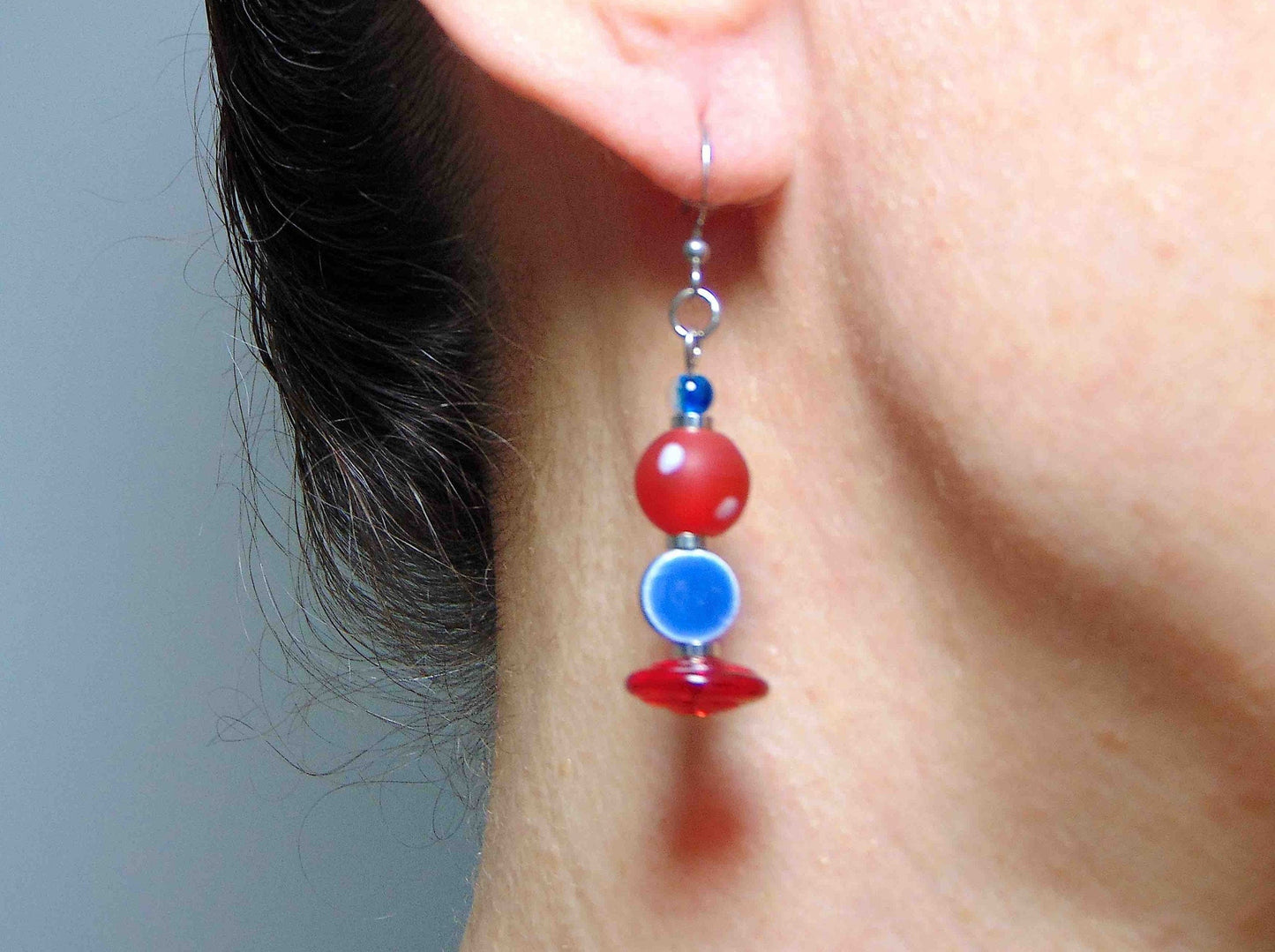 Long earrings with white dotted red balls, blue pellets and translucent red disks, stainless steel hooks