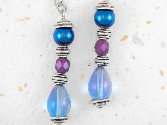 Long earrings with iridescent blue teardrops, metallic blue and faceted mauve balls, stainless steel hooks