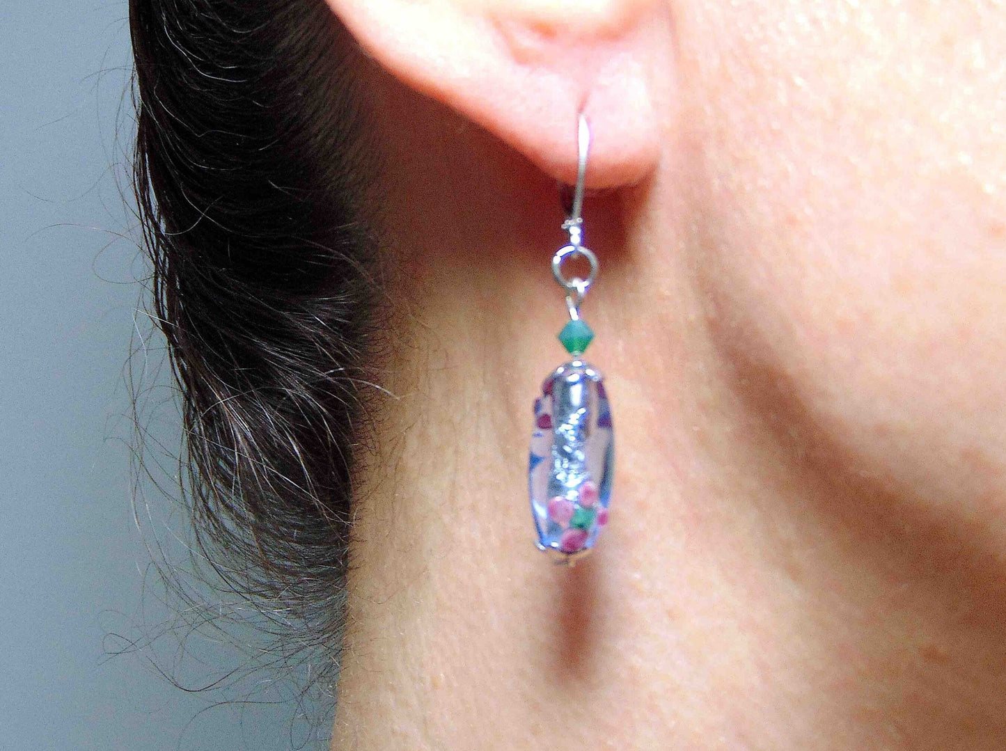 Short earrings with clear blue glass cylinders, silver foil and tiny pink flower details, opal green Swarovski crystals, stainless steel lever back hooks