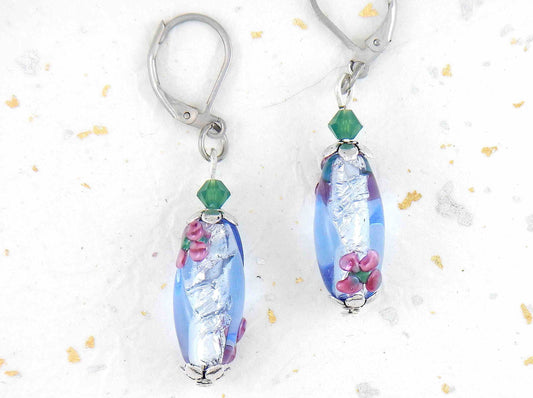 Short earrings with clear blue glass cylinders, silver foil and tiny pink flower details, opal green Swarovski crystals, stainless steel lever back hooks