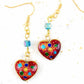 Long earrings with enamelled hearts in 3 colours (red, turquoise, black), geometric patterns, assorted Swarovski crystal cubes, gold-toned stainless steel hooks