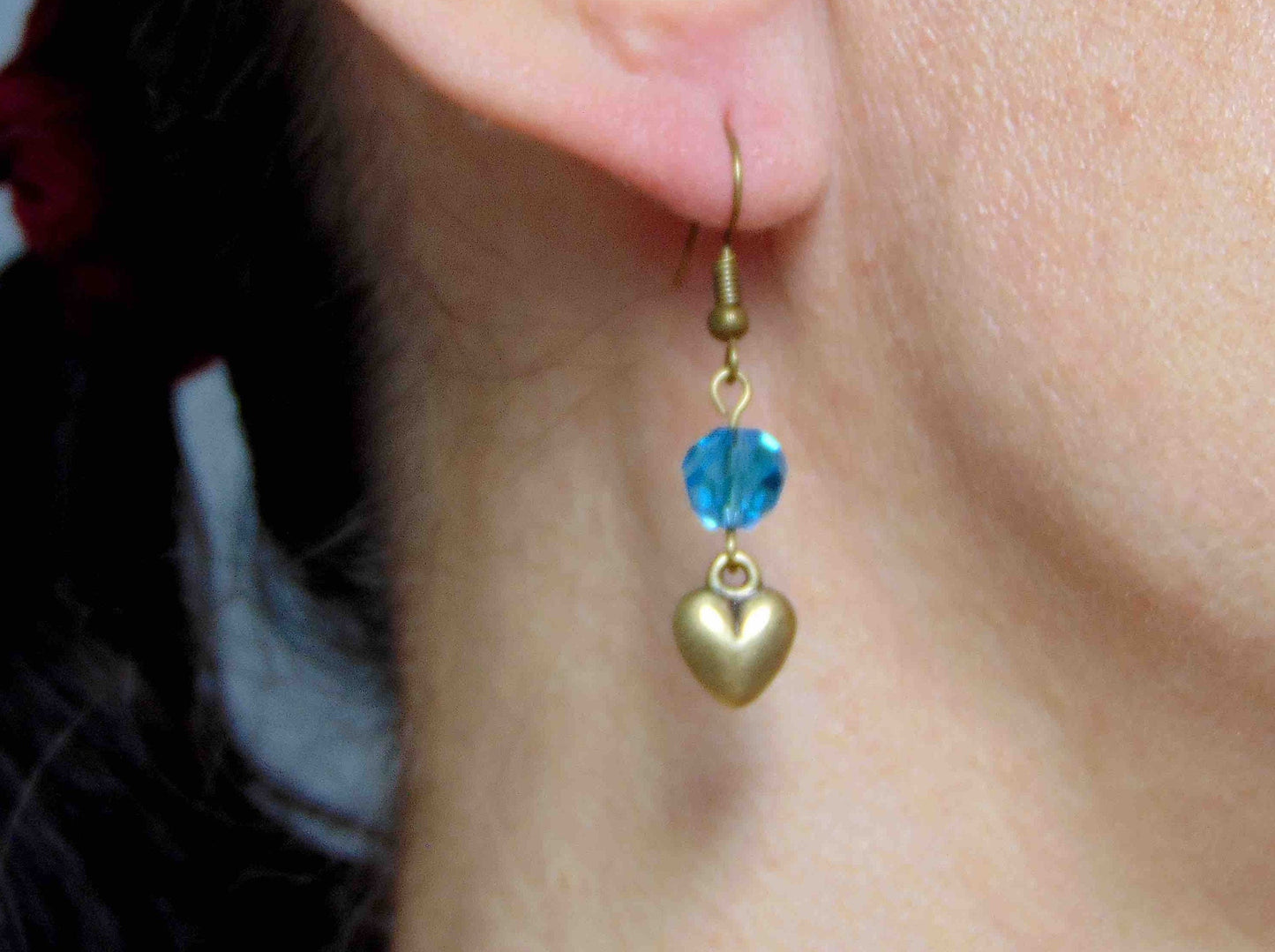 Long earrings with plump brass hearts and translucent turquoise faceted crystal balls, brass hooks