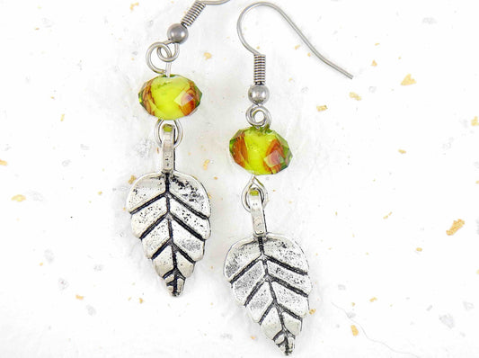 Long earrings with pewter leaves and lime green faceted crystal balls, tiny rose detail, stainless steel hooks