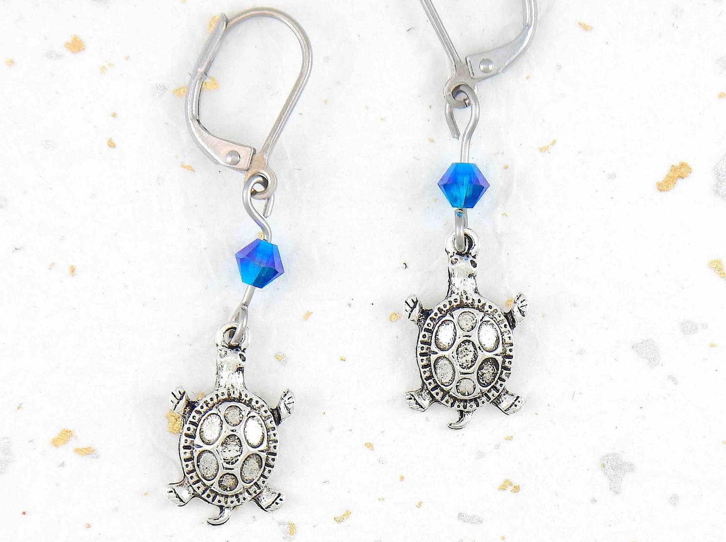 Long earrings with small silver turtles and metallic blue Swarovski crystals, stainless steel lever back hooks