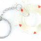 Keychain with handmade resin circle, tiny red and silver hearts, stainless steel chain