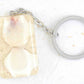 Keychain with handmade resin rectangle, white beach sand, white and pink shells, stainless steel chain