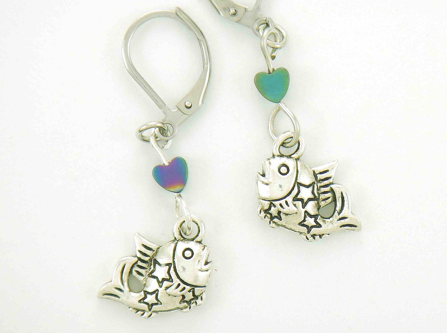 Short earrings with small pewter jumping fish and iridescent hematite hearts, stainless steel lever back hooks