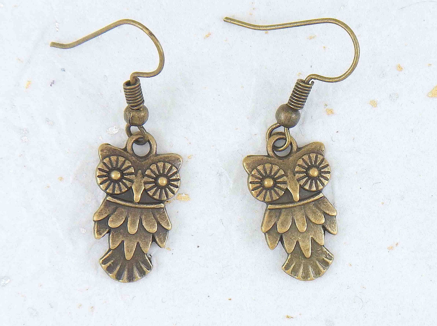 Short earrings with small brass owls, brass hooks