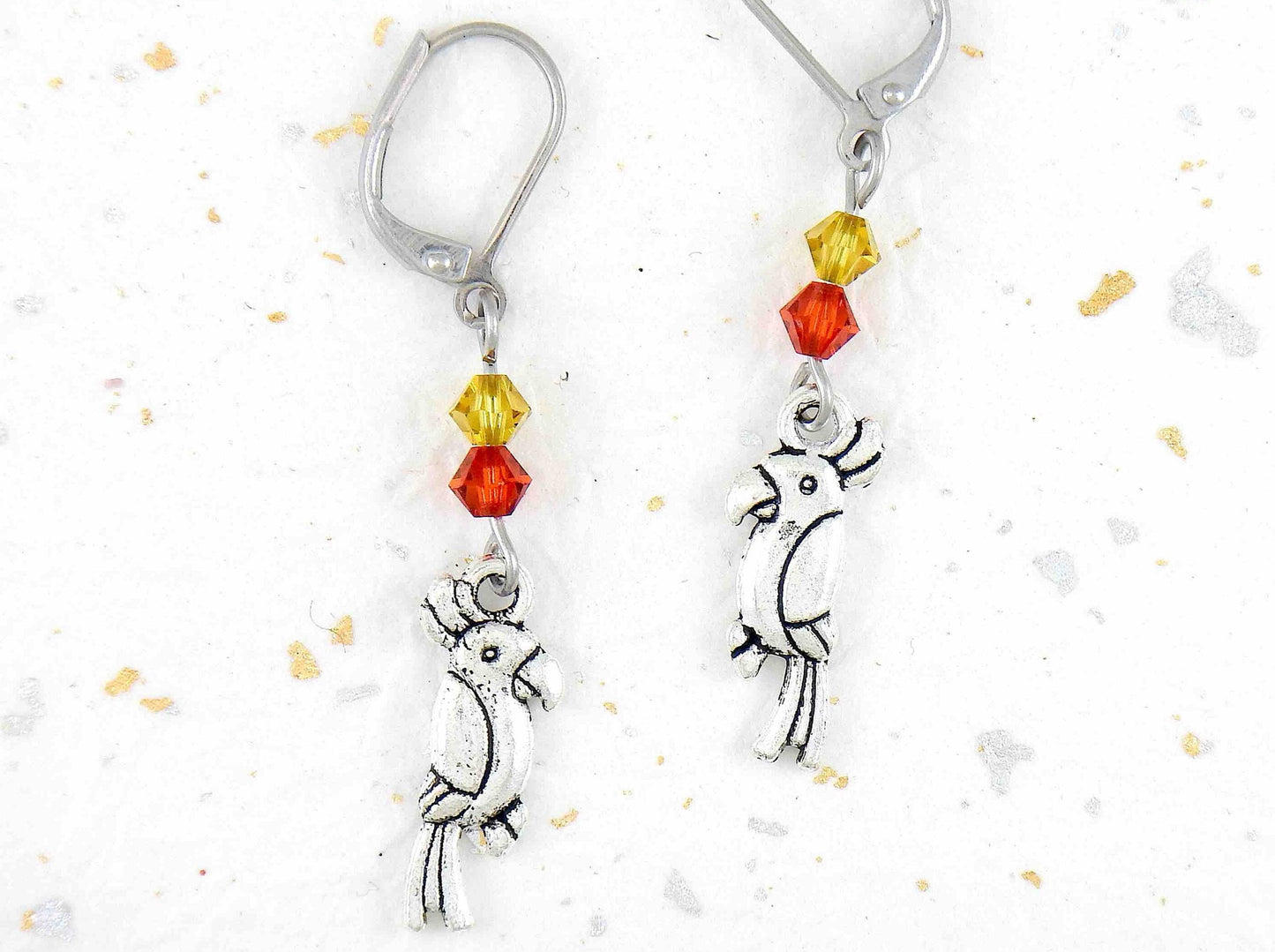 Long earrings with small pewter cockatoos (parrots) and Swarovski crystals, stainless steel lever back hooks