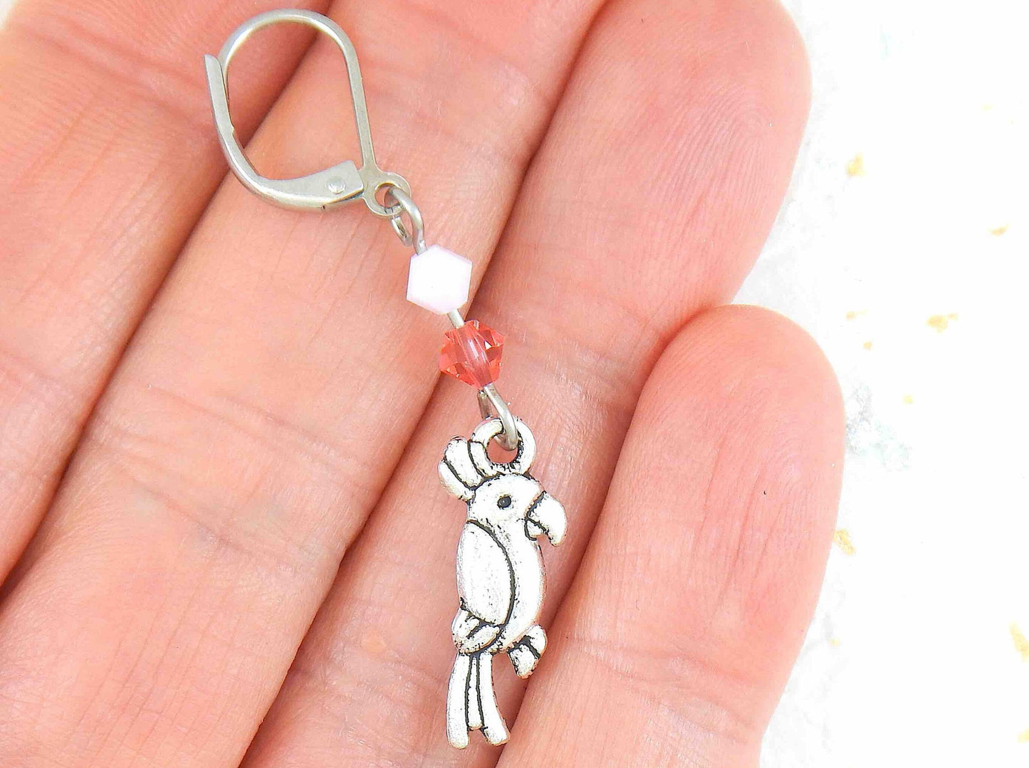 Long earrings with small pewter cockatoos (parrots) and Swarovski crystals, stainless steel lever back hooks