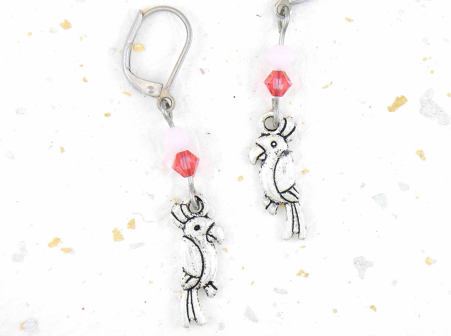 Long earrings with small pewter cockatoos (parrots) and Swarovski crystals, stainless steel lever back hooks