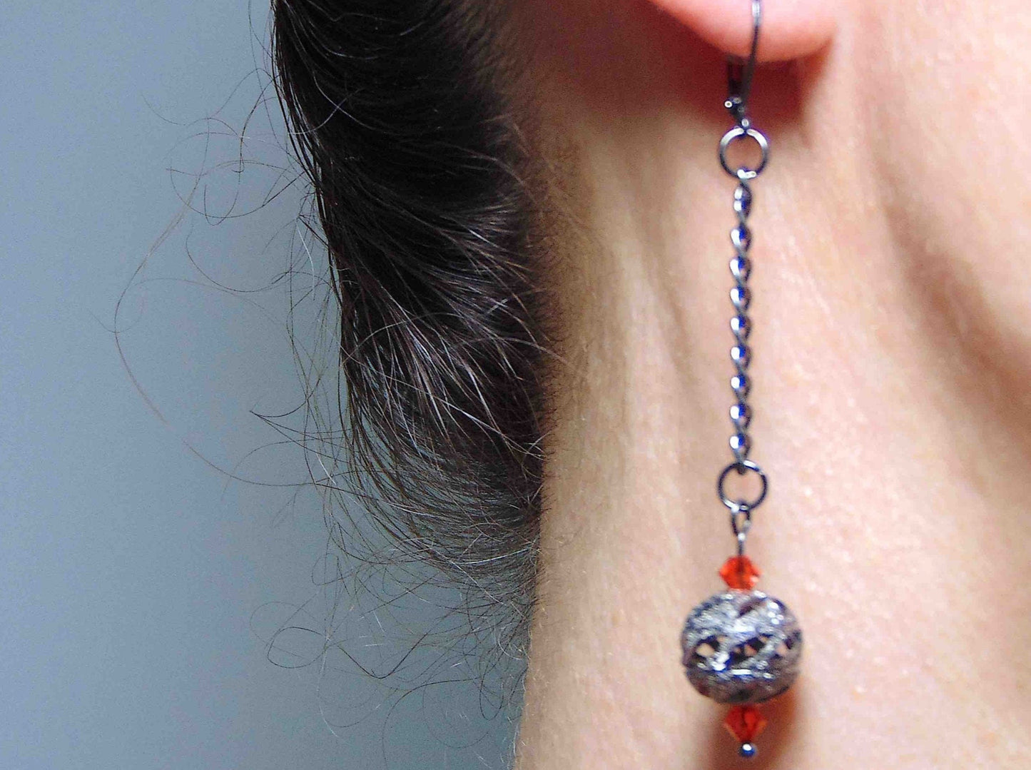 Long earrings with black nickel filigree balls and Swarovski crystals, black-nickel metal lever back hooks