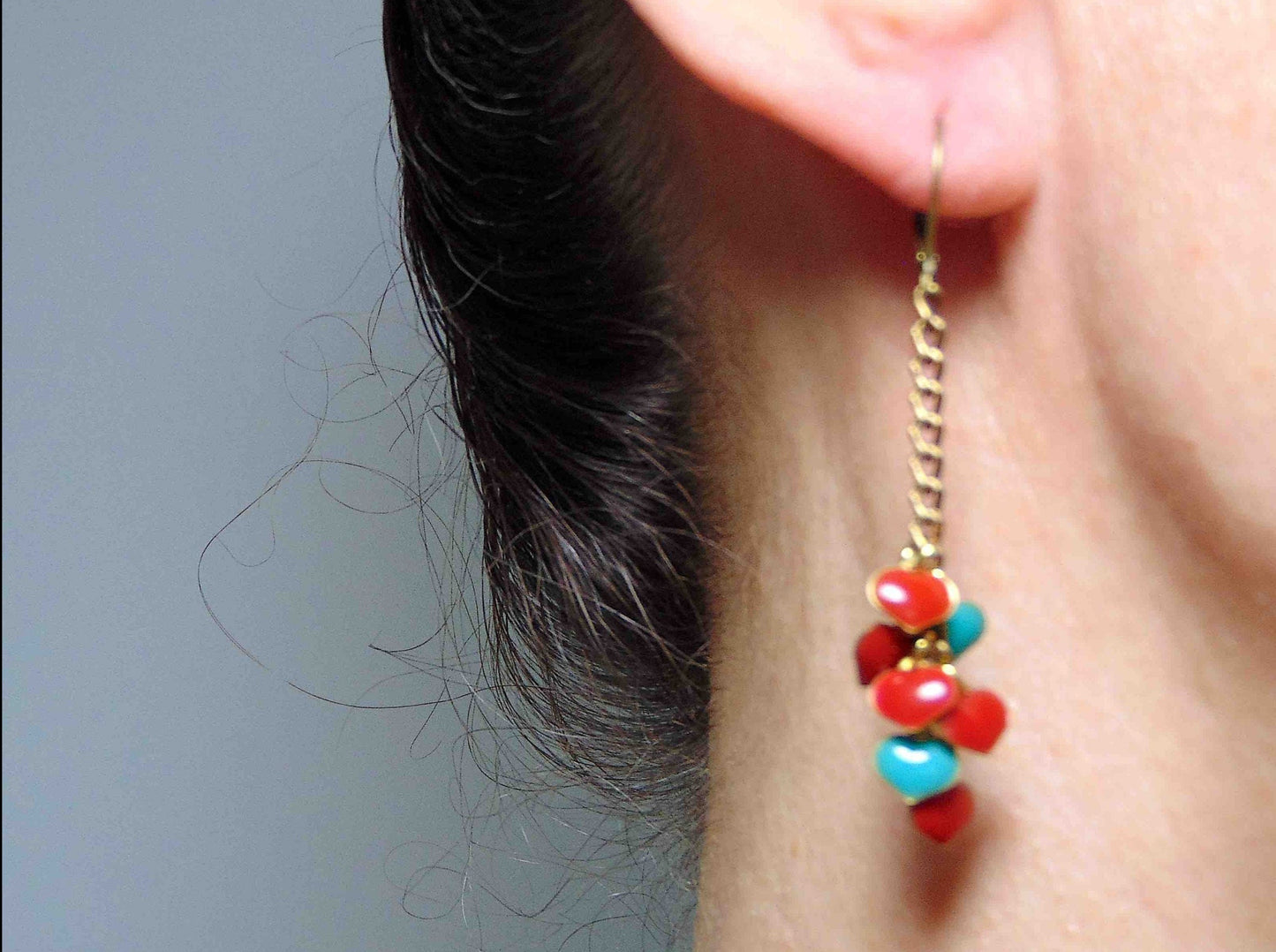 Long earrings with 7 small cascading red and turquoise enamelled brass hearts, aluminum chain, brass lever back hooks