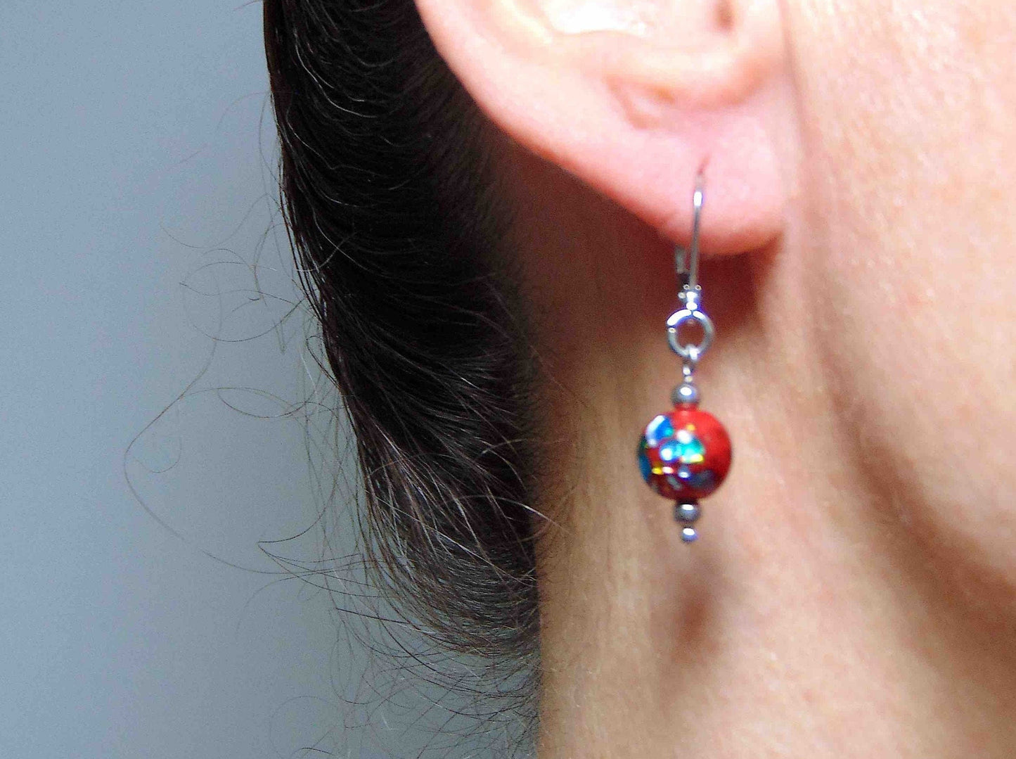 Short earrings with bright red vintage glass balls, metallic silver-yellow-green-blue inclusions, stainless steel lever back hooks