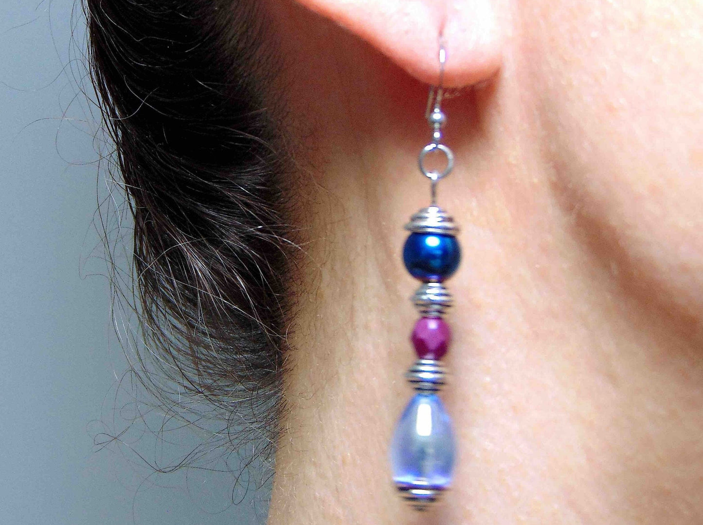 Long earrings with iridescent blue teardrops, metallic blue and faceted mauve balls, stainless steel hooks