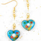 Long earrings with enamelled hearts in 3 colours (red, turquoise, black), geometric patterns, assorted Swarovski crystal cubes, gold-toned stainless steel hooks