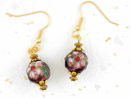 Short earrings with enamelled brass earrings in plum and pink, flower and leaf details, gold-toned stainless steel hooks