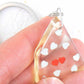 Keychain with handmade resin parallelepiped, tiny red and silver hearts, stainless steel chain