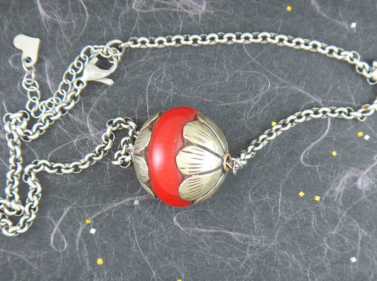 14-inch necklace with pewter and red resin Tibetan ball, stylized flower caps, stainless steel chain