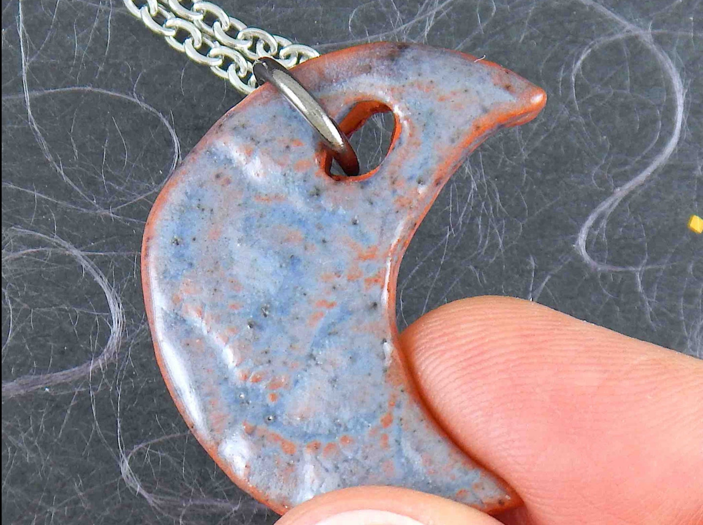 16-inch necklace with smooth jean blue half-moon ceramic pendant handmade in Montreal, stainless steel chain