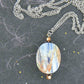 30-inch necklace with large oval kyanite stone slice in blue-silver-bronze, stainless steel chain