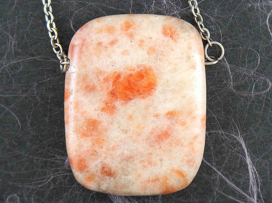 33-inch necklace with smooth rectangular white and rose gold sunstone pendant, stainless steel chain