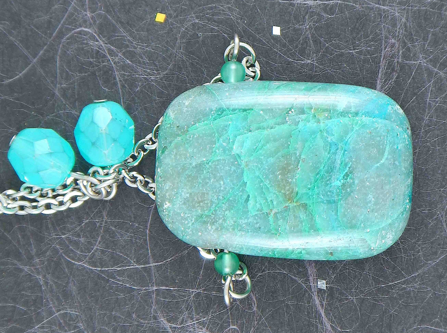 30-inch necklace with large rectangular blue-green chrysocolla stone pendant, triangular layout, matching glass beads, stainless steel chain