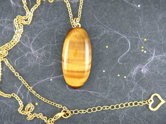 16-inch necklace with oval golden brown tiger eye stone pendant, horizontal pattern, gold-toned stainless steel chain
