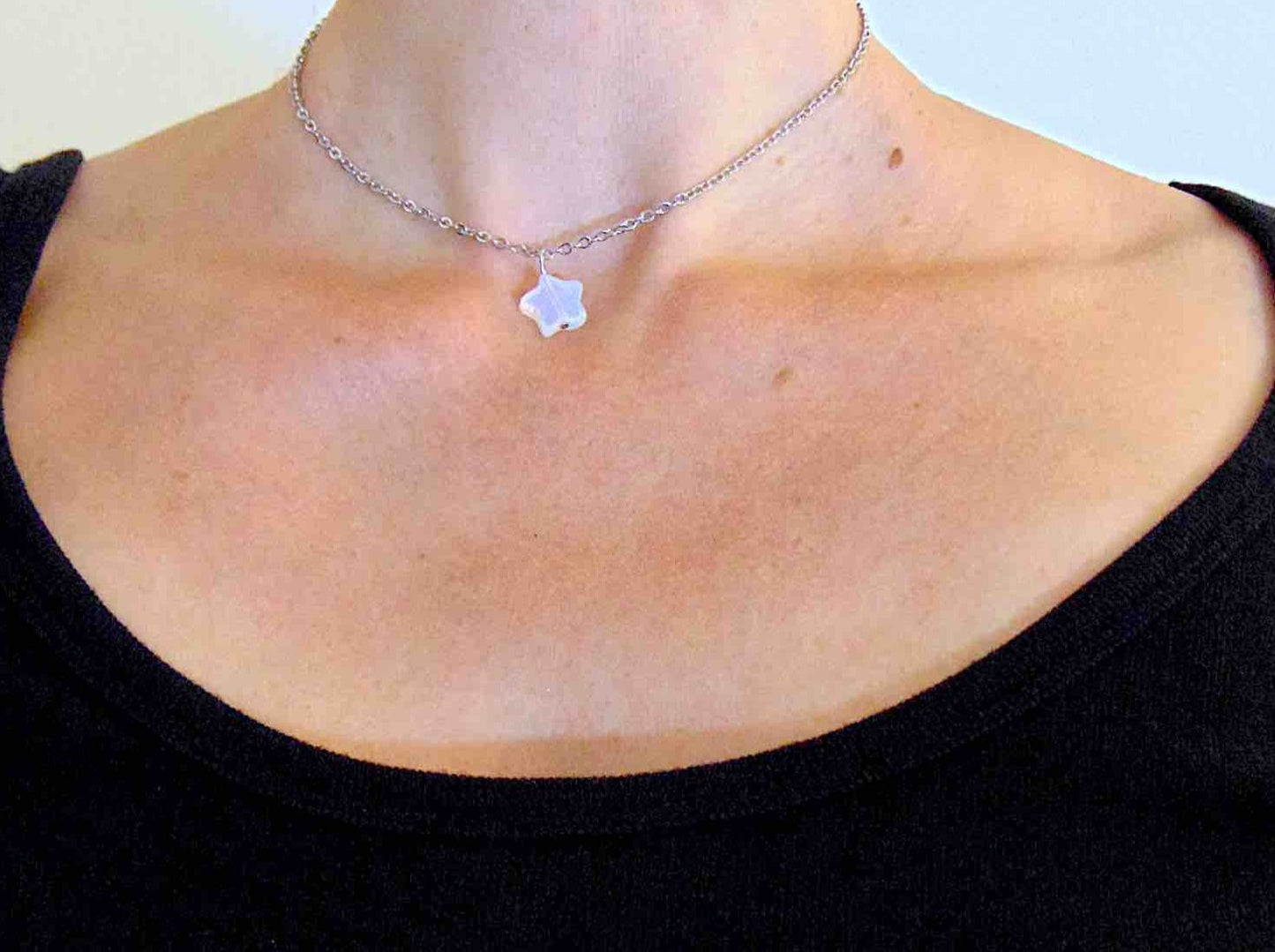 14-inch necklace with small opalescent white synthetic moonstone (opalite) star-shaped pendant, stainless steel chain