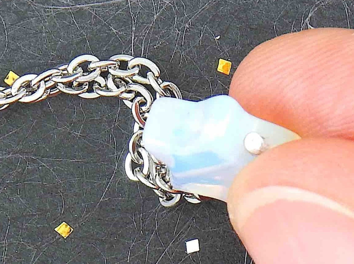 14-inch necklace with small opalescent white synthetic moonstone (opalite) star-shaped pendant, stainless steel chain