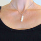 16-inch necklace with column pendant made of 4 fused natural white freshwater pearls, stainless steel chain