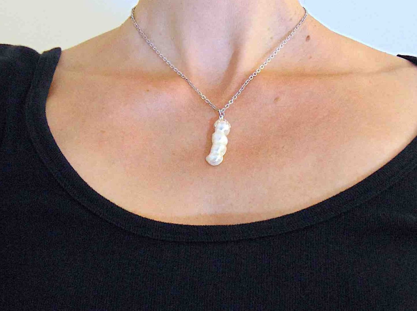 16-inch necklace with column pendant made of 4 fused natural white freshwater pearls, stainless steel chain