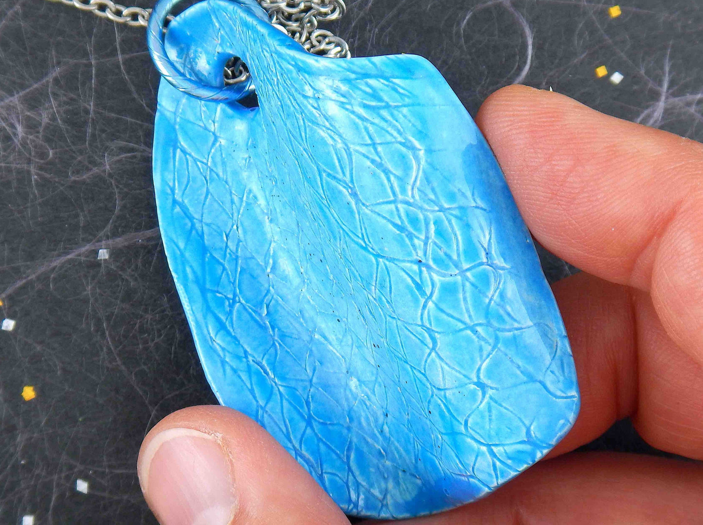 22-inch necklace with large textured bright turquoise wave ceramic pendant handmade in Montreal, stainless steel chain