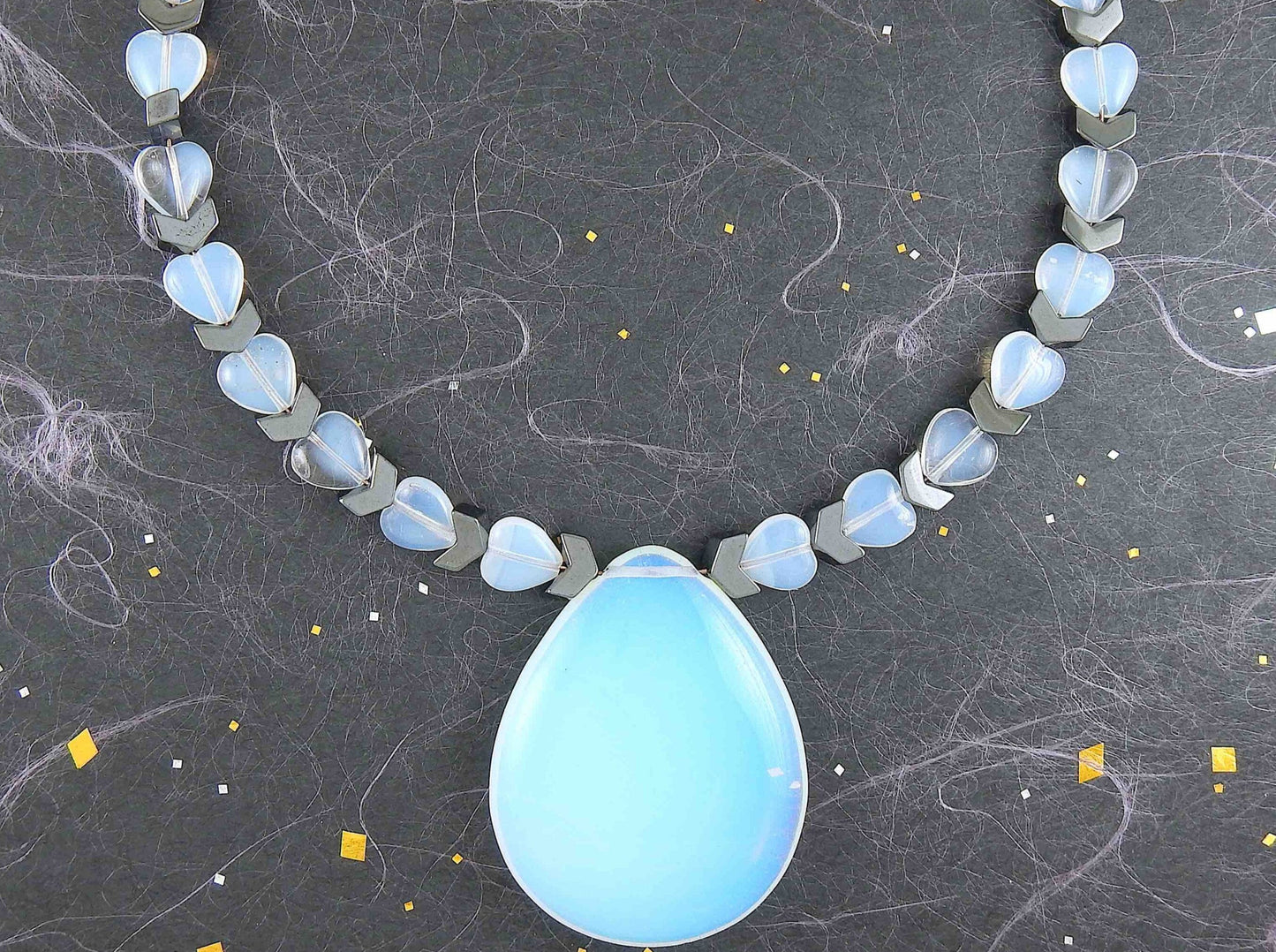 Choker necklace with 50mm synthetic moonstone (opalite) drop pendant, tiny hearts, hematite chevrons, metal