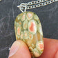 25-inch necklace with smooth square pendant of golden green and red rainforest jasper stone, stainless steel chain