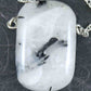 26-inch necklace with rectangular black and white tourmalined quartz stone pendant (a rare mix), stainless steel chain