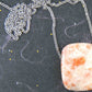 33-inch necklace with smooth rectangular white and rose gold sunstone pendant, stainless steel chain