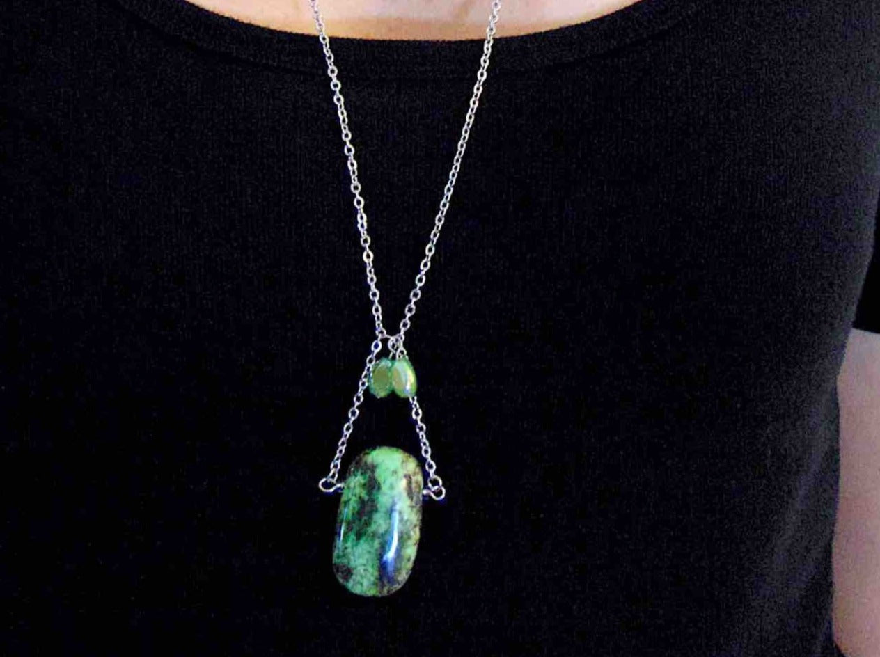 30-inch necklace with large rectangular light green and black chrysoprase stone pendant, triangular layout, matching glass beads, stainless steel chain