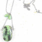 30-inch necklace with large rectangular light green and black chrysoprase stone pendant, triangular layout, matching glass beads, stainless steel chain