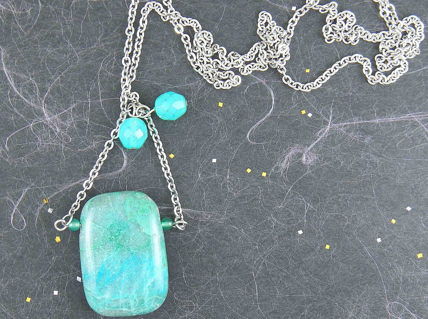 30-inch necklace with large rectangular blue-green chrysocolla stone pendant, triangular layout, matching glass beads, stainless steel chain