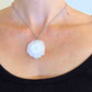 16-inch necklace with large white solar quartz stone circular pendant, drop-shaped center, stainless steel chain
