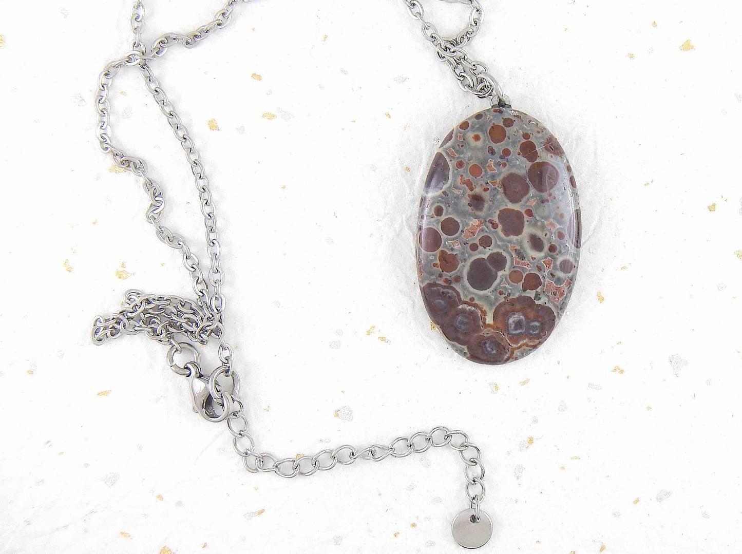 16-inch necklace with oval leopard jasper stone pendant, burgundy and chocolate brown dots on blue-grey background, stainless steel chain