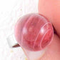 Finger ring with large marbled pink vintage glass dome, adjustable stainless steel base