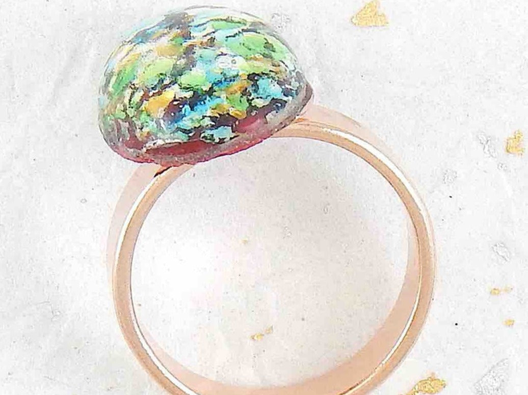 Finger ring with red oval vintage glass cabochon, blue-green-gold-silver speckles, stainless steel adjustable base