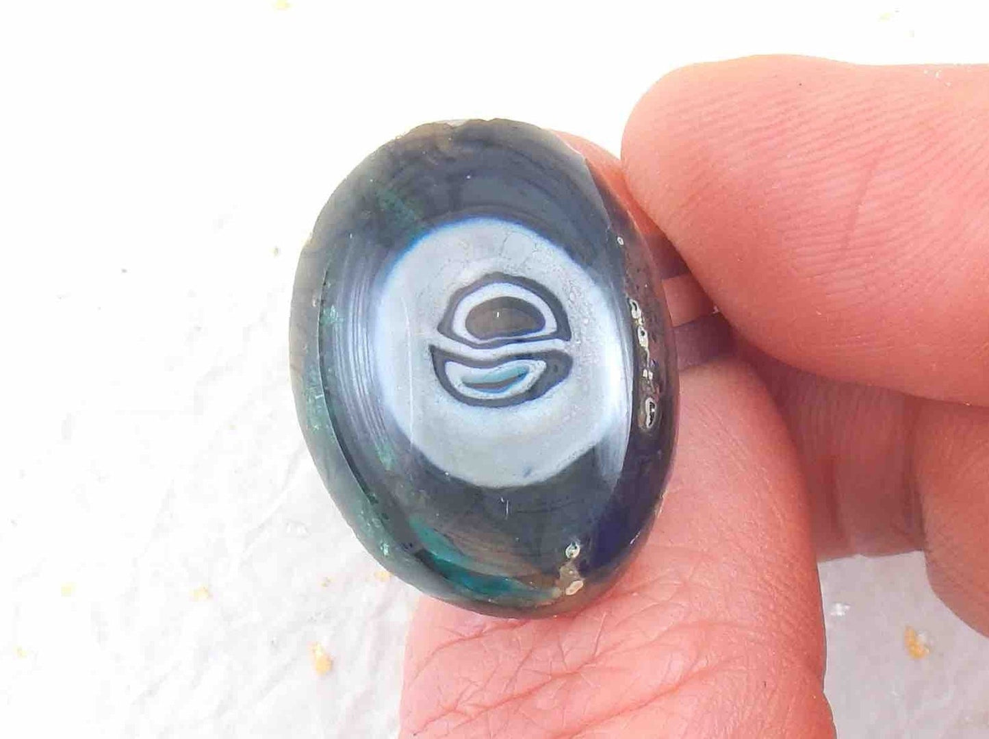 Finger ring with large oval dark green cabochon (Murano style glass handmade in Montreal), white yin-yang pattern, stainless steel adjustable base (US 8-9)