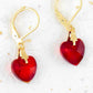 Short earrings with 10mm faceted Siam (deep red) Swarovski crystal hearts, gold-toned stainless steel lever back hooks
