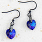 Short earrings with 10mm faceted Heliotrope (deep blue and violet) Swarovski crystal hearts, black stainless steel hooks