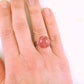 Finger ring with large marbled pink vintage glass dome, adjustable stainless steel base