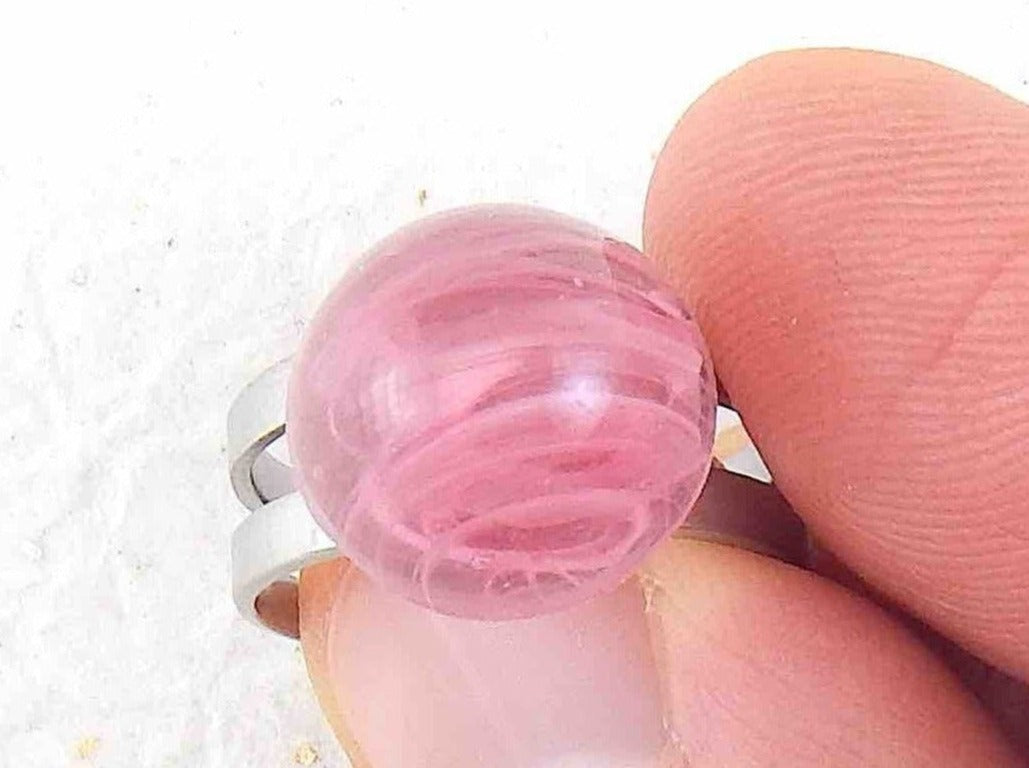 Finger ring with small marbled pink vintage glass dome, adjustable stainless steel base
