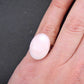Finger ring with oval natural pink opal stone cabochon, stainless steel adjustable base (US 5-6)